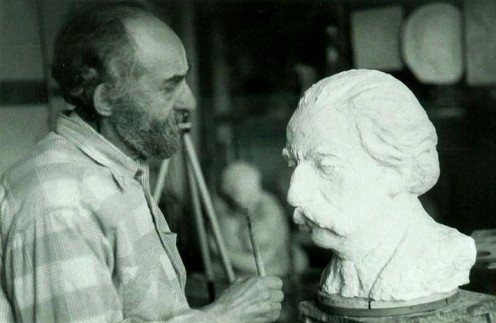 Lev is working on the bust of Yuri Lotman in his working room